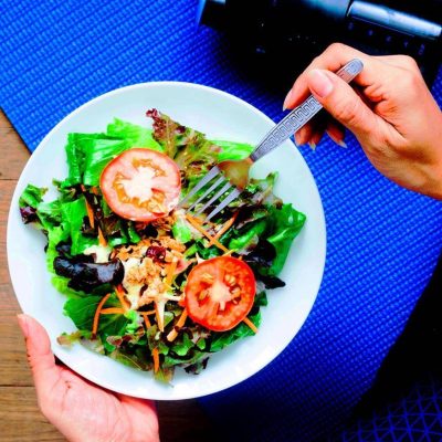 Yoga woman eating fresh salad, Fitness and Healthy concept